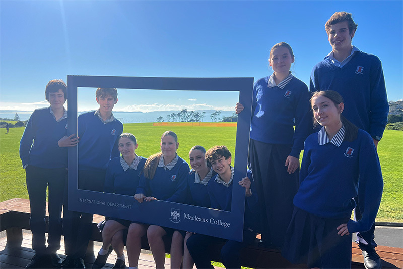 Macleans College international students from Austria, Germany and Switzerland on the school fields, overlooking the sea