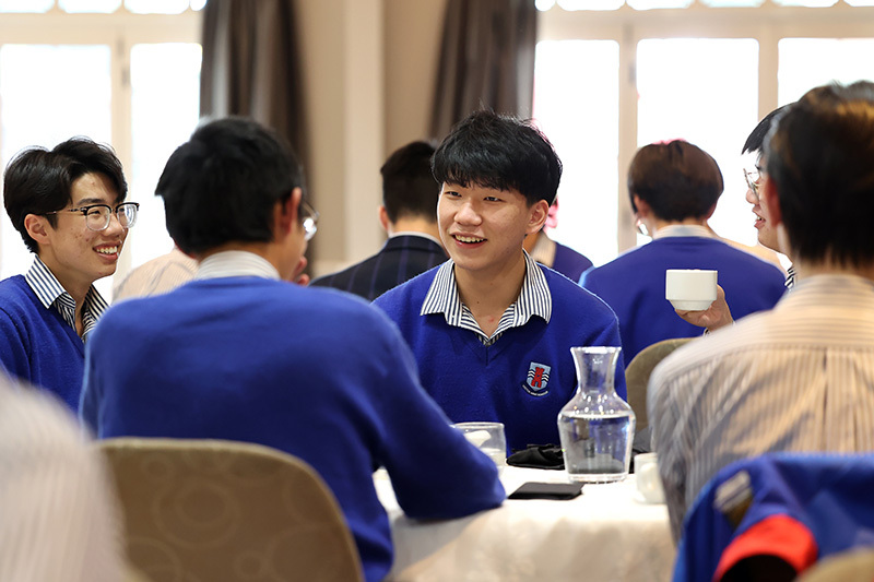 Macleans College international students in conversation at their graduation