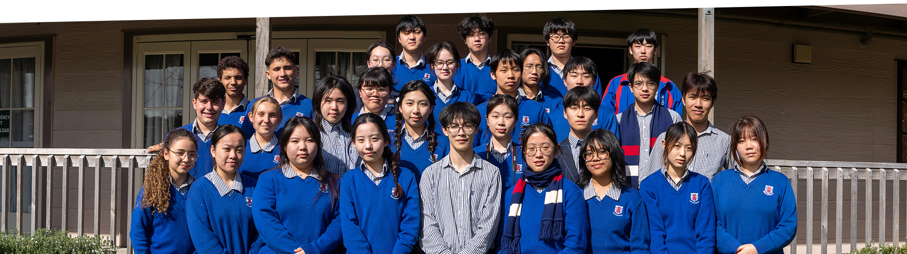 A group of Macleans College international students at graduation