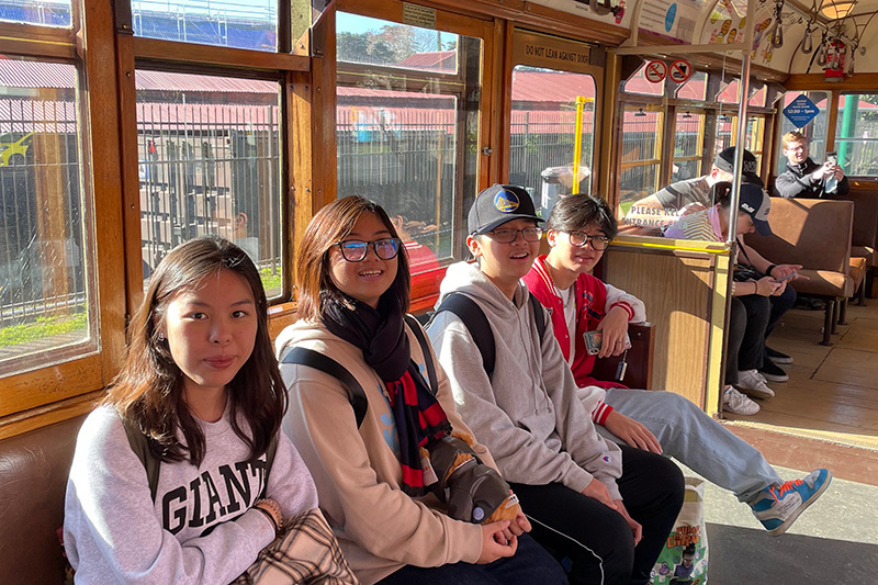 Macleans College international students enjoying a ride on the MOTAT tram around Western Springs