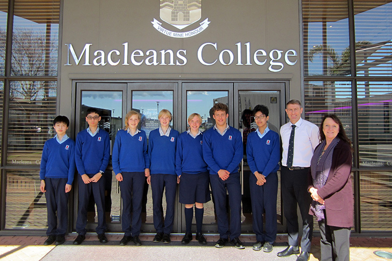 Macleans College international students at the school entrance with the Principal