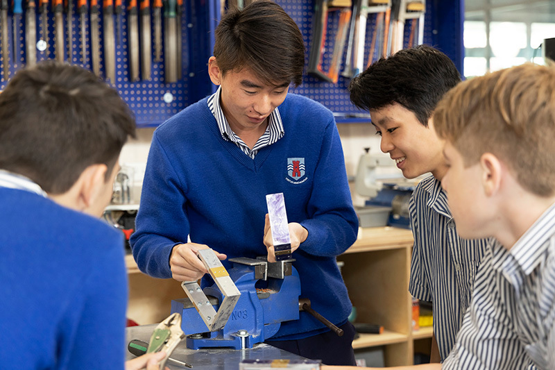 Macleans College students admiring their engineering work in the Technology Block