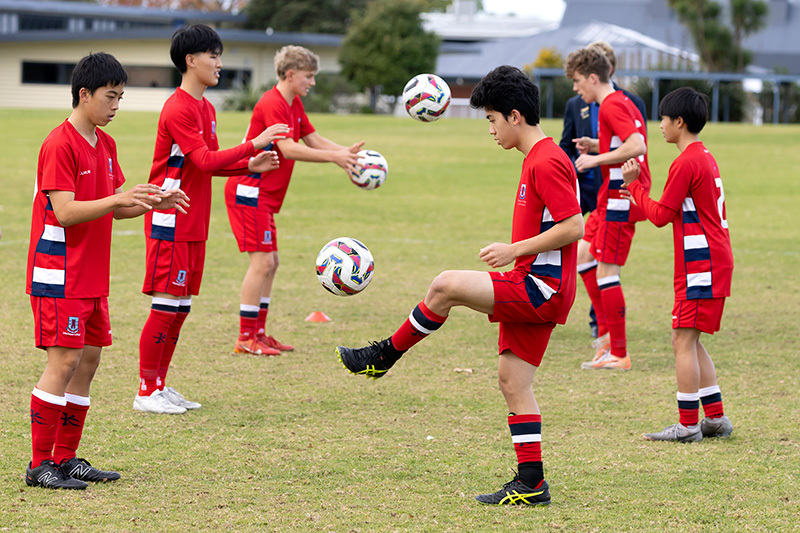 Macleans College students warming up for a football match