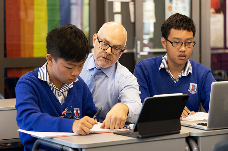Macleans College students using laptops during a lesson with their teacher