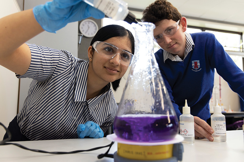 Macleans College students undertaking a chemistry experiment in the science laboratory